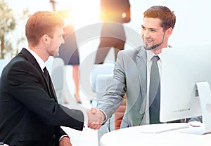 Handshake Manager and the client in the office.