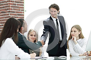 Handshake Manager and customer in a modern office