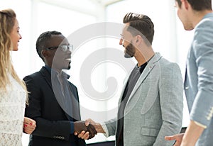 Handshake the Manager and employee in the office