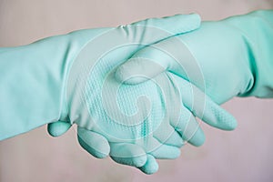 Handshake with medical gloves