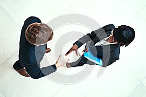 Handshake, meeting and partnership with business team in office for agreement or deal from above. Corporate, hiring or