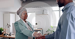 Handshake, meeting and partnership with a man and black woman shaking hands for a business deal or greeting. Teamwork