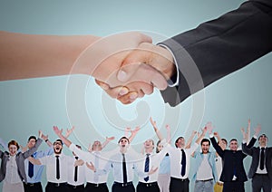 Handshake over business people with blue background