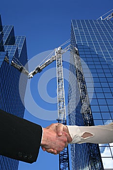 Handshake over construction site