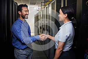 Handshake, partnership or happy people in server room of data center for network help with IT support. B2b deal