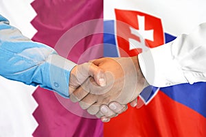 Handshake on Qatar and Slovakia flag background