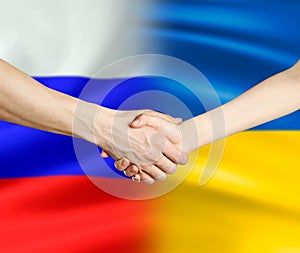 Handshake of Russia and Ukraine. The end of the war. Close up