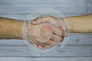 Handshake in a steel chain