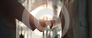 The handshake symbolizes partnership and unity in a modern business environment..AI generated image