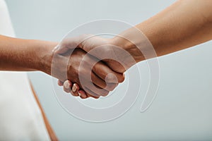 Handshake and sympathetic understanding between female hands