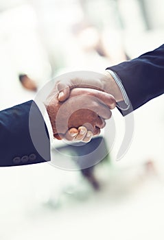 Handshake, team and business men in office with b2b deal, collaboration or agreement. Professional, partnership and