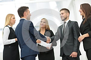 Handshake to seal a deal after a job recruitment meeting in a of