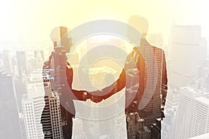 Handshake of two businessperson in office concept of partnership and teamwork.double exposure