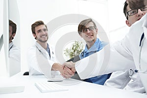 Handshake two medical colleagues