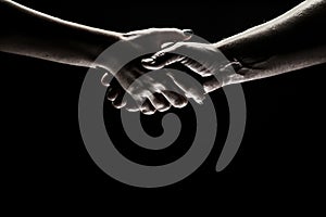 Handshake between the two partners. Rescue or helping gesture of hands. Concept of salvation. Hands of two people at the