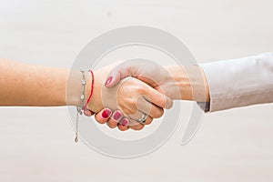 Handshake of two women. Struggle for equal rights, agreement