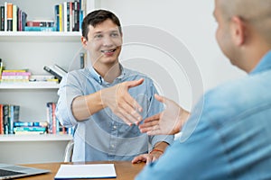 Handshake of young businessman after succesful job interview