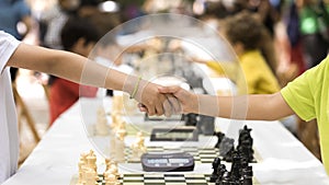 Handshake of the young people after the end of the game as a sign of sportsmanship and fair play. Concept of fairness, justice,