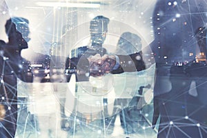 Handshaking business person in office. concept of teamwork and partnership. double exposure