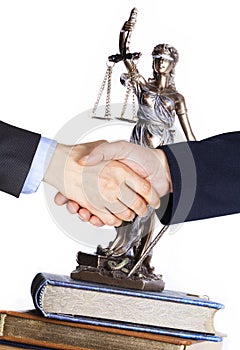 Handshaking in front of justice symbol