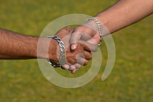 Handshaking moments with green background stock photograph