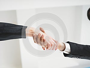 Handshaking in office low angle