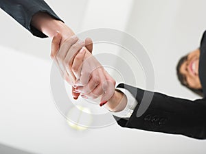 Handshaking in office low angle