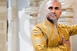 Handsom Indian Man in Gold Kurta at the Temple