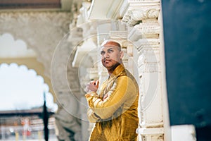 Handsom Indian Man in Gold Kurta at the Temple