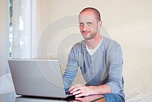 Handsom young businessman working at home