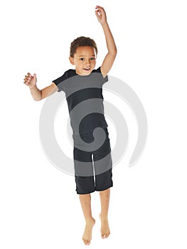 Handsome african american boy jumping up on white background