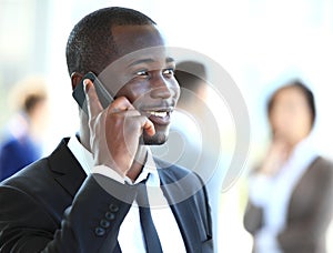 Handsome african american businessman talking on mobile phone