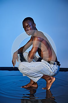 handsome african american man in jeans