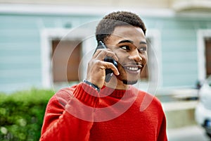 Handsome african american man outdoors speaking on the phone