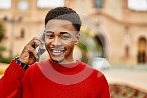 Handsome african american man outdoors speaking on the phone