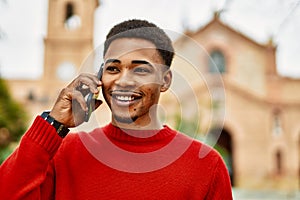 Handsome african american man outdoors speaking on the phone