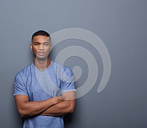 Handsome african american man posing with arms crossed