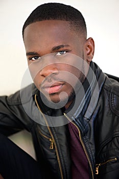 Handsome african american man posing in black leather jacket