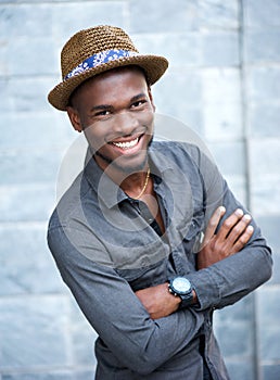 Handsome african american man smiling with arms crossed