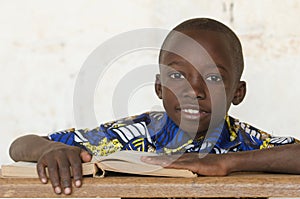 Handsome African black boy studying a Book in Bamako, Mali