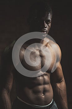 Handsome African bodybuilder man with naked muscular torso. Sport Concept.