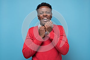 Handsome african man being surprised for mistake, remember error.