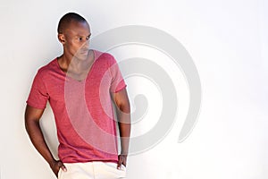 Handsome african man standing against white background