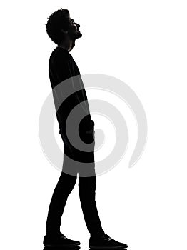 handsome african young man standing looking up smiling silhouette