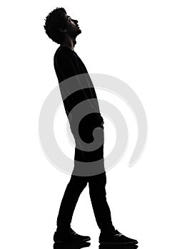 handsome african young man standing looking up surprise silhouette