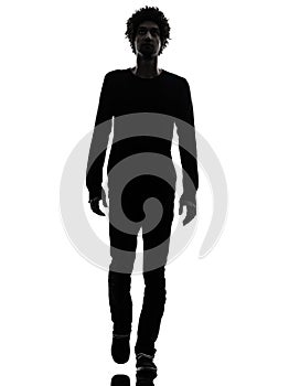 Handsome african young man walking looking up silhouette
