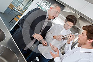 handsome apprentices and teacher at school