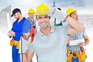 Handsome architect holding drill machine