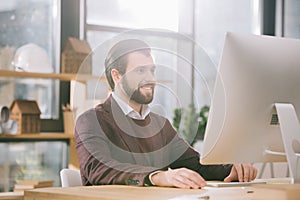 handsome architect working with computer in office