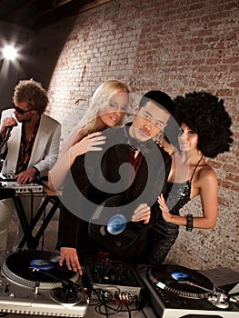 Handsome Asian DJ at a 1970s Disco Music Party photo